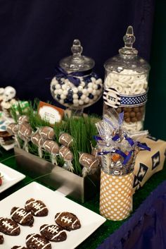 a table topped with lots of desserts and candies