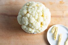 the cauliflower is ready to be cut and put into pieces on the plate