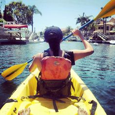 a person in a kayak paddling on the water