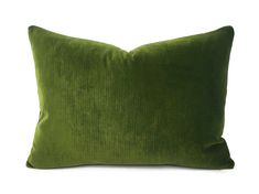 a green pillow on a white background with no one in the photo to describe it