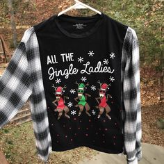 "Reworked holiday flannel tee size S-M, upcycled oversized t-shirt with humorous graphic \"All the Jingle Ladies.\"  This is a sustainable refashioned long-sleeved pullover top with long sleeves and fringy hems.  It would complete a fun, cozy outfit for your holiday shopping or outings!    These pieces are created to be an oversized fit. Please see measurements and approximate sizing below. DETAILS: APPROXIMATE SIZE:  Small to Medium Brands:  Universal Thread Materials:  Cotton MEASUREMENTS: Top of shoulder to bottom hem:  23 inches Width across front at armpit:  21 inches Be sure to check the size and measurements.  Sizing for clothing brands is often different! Hint:  To be sure this item will fit, lay your favorite shirt out flat and take measurements of the same areas listed above. Thi Holiday Flannel, Flannel Outfits, Refashion Clothes, Cozy Outfit, Casual Winter Outfits