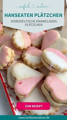 some cookies with pink icing are on a red and white plate next to the words hanseat platzchen