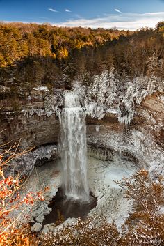 an instagram photo of a waterfall in the middle of winter with snow on it