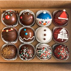 a box filled with chocolate covered cupcakes and frosting