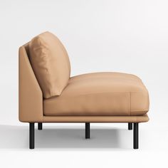 a tan leather chaise lounge chair with black legs and back rests on a white background