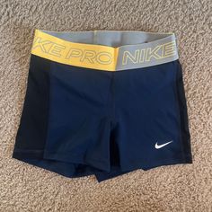 Multi Color Blue And Dark Blue Sides, Never Worn Nike Yellow Sport Bottoms, Yellow Go-dry Sports Shorts, Nike Yellow Workout Shorts, Sporty Yellow Athletic Shorts With Short Leg, Sporty Yellow Shorts For Training, Stretch Yellow Nike Bottoms, Yellow Stretch Nike Bottoms, Nike Stretch Yellow Bottoms, Nike Blue Training Shorts