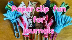 several paper clips are lined up on a table with the words paper clip fun for journals