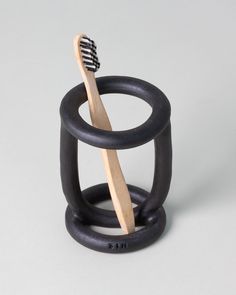 a toothbrush holder made out of black rubber