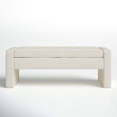 a white bench sitting on top of a white floor