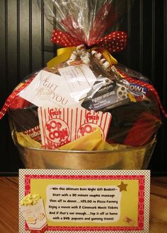 a basket filled with lots of different types of food and candy in front of a sign