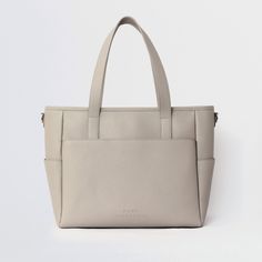 This structured tote is the ultimate do-it-all bag that you deserve. It's the perfect carryall for work, travel, and anywhere your day brings you. It features a spacious and organized interior for your essentials, a padded compartment for your laptop, side pockets for your drinks, and you can convert it into a backpack or crossbody. Crafted from premium American Saffiano leather that's waterproof and scratch-resistant, the Transform Tote will stay just as beautiful through all your travels and a Holster Purse, Concealed Carry Purse, Work Backpack, Laptop Bag For Women, Best Purses, Laptop Tote, Luggage Straps, Leather Laptop Bag, Work Bags