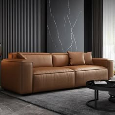 a living room with black walls and leather furniture