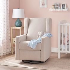 a baby's room with a rocking chair and crib