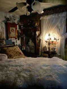 a bedroom with white fur on the floor and curtains hanging from the ceiling, along with an old fashioned bed