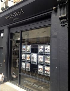 a store front with lots of windows on it