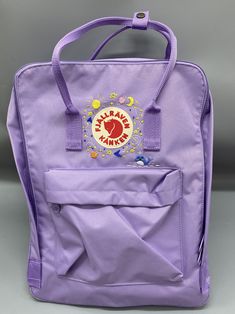 Welcome to my store and choose the perfect hand-embroidered fjallraven kanken backpack   Version & Size + Medium size: 38x27x13cm  + Big size: 42x32x13cm  - Product price includes: hand-embroidered fjallraven kanken backpack and design as shown in the picture - I can make fjallraven kanken backpack hand embroidery patterns according to your ideas - fjallraven kanken backpack will be hand embroidered with thread that won't fade when washed - fjallraven kanken backpack has a small front compartmen Fjallraven Kanken Embroidered, Planets Embroidery, Embroidery Theme, Kanken Classic, Stitch Backpack, Small Planet, Classic Backpack, Hand Embroidery Patterns, Kanken Backpack