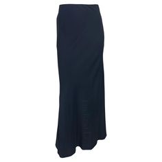 Presenting a stunning navy Gucci maxi skirt, designed by Tom Ford. From the Spring/Summer 1996 collection, this Tom Ford-designed piece fits perfectly at the hips before cascading into a flared cut. This gorgeous, unworn skirt still features its original store tag. Approximate measurements: Size - 40IT Waistband to hem: 44" Waist: 27" Hips: 44 - 46" 53% acetate, 47% viscose Tom Ford For Gucci, Gucci By Tom Ford, Carolyn Murphy, Azzedine Alaia, Gianni Versace, Bergdorf Goodman, Primavera Estate, Tom Ford, Versace