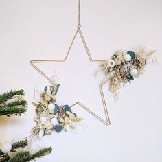 a star hanging on the wall next to christmas decorations