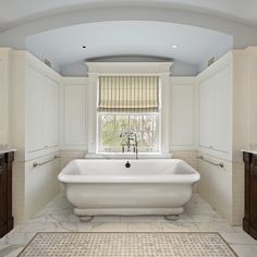 a bathroom with a tub and sink in it