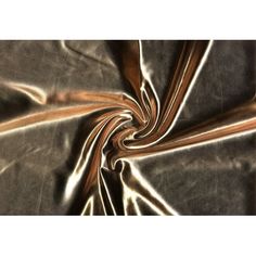 an image of metallic fabric that looks like it is going to fall down in the air