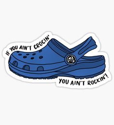 a pair of blue clogs with the words, if you ain't croc