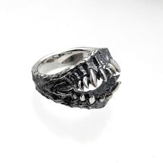 made by Strange Freak Designs SFD-R-133 creature skull mouth and fang. teeth silver 925 ring made in JAPAN if you want other ring gauge please contact us. Gothic Claw Shaped Metal Rings, Gothic Claw Rings As Gift, Gothic Hand Cast Metal Rings, Gothic Metal Rings, Silver Punk Claw Rings, Gothic Metal Rings With Oxidized Finish, Gothic Rings With Oxidized Metal Finish, Fang Teeth, 925 Ring