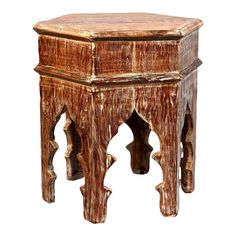 an old wooden side table with carvings on the top and bottom, isolated against a white background