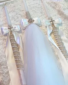 two white wedding garters with bows on them