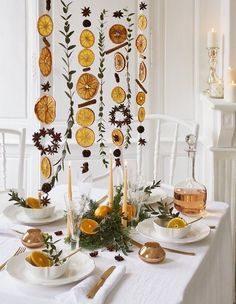 the table is decorated with orange slices and greenery