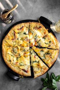 a pizza sitting on top of a pan covered in cheese