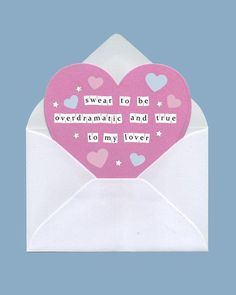 an open envelope with a pink heart shaped card inside it and the words swear to be overdraamistic and true, tony lover