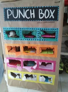 the punch box is made out of paper and has several compartments for different types of items