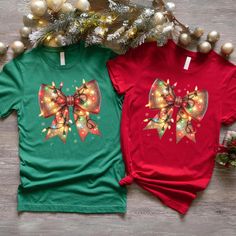 Christmas Bow T-shirt, Christmas Light Coquette Bow shirt, Couples Tee for Christmas Eve Party T-shirt, Xmas Holiday Themed Tee Check it out our other Most Likely To Shirts and Sweatshirts; https://www.etsy.com/shop/MyNewCustomTshirt?section_id=45667553 Our personalized t-shirts are made from high-quality materials that feels great against your skin. With a range of colors and designs to choose from, you're sure to find a shirt that matches your personality and style. Whether you're looking for a funny graphic tee, a statement piece with bold, eye-catching artwork, or a classic design with a twist, we have something for everyone. Perfect for casual outings, concerts, or even just lounging around the house, our t-shirts are comfortable, stylish, and versatile. Plus, they make great gifts fo Christmas Festive Shirt With Graphic Print, Festive Christmas Graphic Print Shirt, Green Christmas T-shirt For Holiday, Red Holiday Shirt For Gift, Holiday Red Shirt As Gift, Red Holiday Shirt Gift, Pre-shrunk Short Sleeve Christmas Tops, Graphic Print Top As Christmas Gift, Green T-shirt For Christmas Holiday