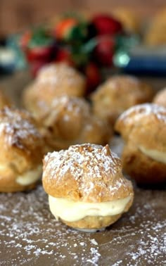 several pastries on a table with powdered sugar