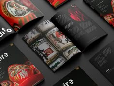 an open magazine with red and black designs on the front, back and side pages