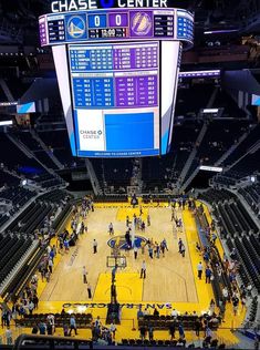 an overhead view of a basketball court with people on the court and in the stands