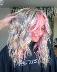 50+ Amazing Pink Hair Ideas That Are Super Trendy; pink highlights! This includes pink hair color ideas, pink hair streaks, pink hair aesthetic, pink hair highlights, pink hair color, pink hair ideas & more! This also includes pink hair color ideas for blondes, pink hair color ideas for short hair, pink hair color ideas dark roots, pink hair aesthetic girl, pastel pink hair, neon pink hair, bright pink hair, fun pink hair, cute pink hair & more! #pinkhair #pinkhaircolor #pinkhairstreaks Cotton Candy Blonde Hair, Blonde Hair With Pink Strands, Blonde Hair With Pink Curtain Bangs, Platinum Blonde With Pink Tips, Blonde Pink And Purple Hair, Pink Front Hair Streaks, Pearl Pink Hair, Pink Halo Hair Blonde, Pop Of Color In Blonde Hair