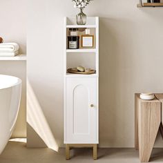 a bathroom with a white bath tub and wooden shelves