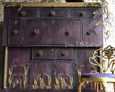 an old dresser and chair are sitting next to each other