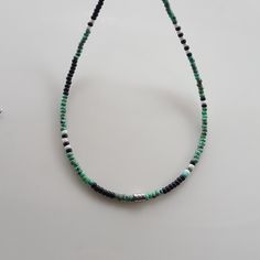 Elevate your summer bohemian style with this unique Mens Beaded Necklace! This Boho-inspired piece is perfect for adding a touch of flair to any outfit. Handcrafted with high-quality beads, this versatile Mens Necklace can also be styled as a beaded choker for a trendy look. Whether you're shopping for yourself or looking for beaded necklaces for women gifts, this necklace is sure to make a statement. Upgrade your accessory game with this one-of-a-kind beaded necklace today! Miyuki round 8/0 Pic Bohemian Black Beads Jewelry, Bohemian Summer Necklace With Black Beads, Bohemian Black Beads Necklace For Summer, Bohemian Black Beaded Necklaces For Summer, Bohemian Adjustable Silver Beads, Adjustable Bohemian Silver Beads, Summer Bohemian Gemstone Beads, Hippie Beaded Necklaces With Gemstone Beads For Beach, Bohemian Turquoise Beaded Bracelets With Black Beads