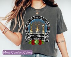 Get into the holiday spirit with our "Hoppy Holidays Brewing Co." Comfort Colors® Shirt, perfect for beer lovers and Christmas enthusiasts alike! This cozy tee features a vintage-inspired beer company logo with a festive twist, combining warmth and style in true Comfort Colors® fashion. Whether you're enjoying a winter brew by the fire or out spreading holiday cheer, this shirt is sure to be your go-to for the season. AI has been used to assist with this design image. Welcome to our store!  Prod Christmas Beer Shirts, Festival Tshirt, Beer Christmas, Christmas Holiday Party, Beer Company, Gifts For Beer Lovers, Beer Festival, Design Image, Beer Lovers