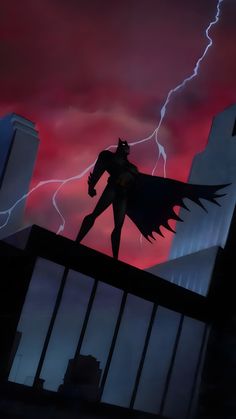 the animated batman is standing on top of a building with lightning in the sky behind him