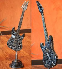 two different views of a guitar made out of metal