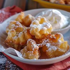 a white bowl filled with dessert on top of a table