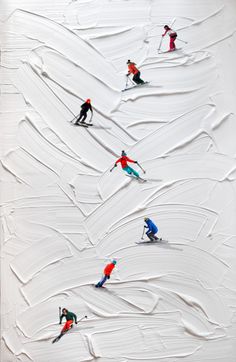 several skiers are skiing down a snow covered slope in the same direction as one another