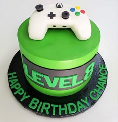 a birthday cake with a video game controller on top