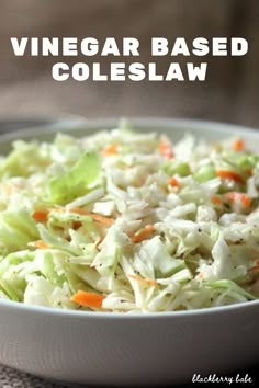 a white bowl filled with coleslaw and carrots on top of a table