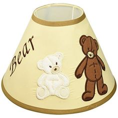 a lamp shade with a teddy bear on it and the word bear written in brown