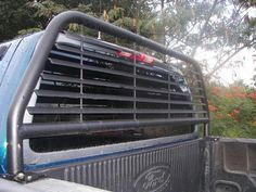 the back end of a truck with an air conditioner on it's flat bed