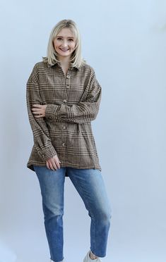 The Boone Day Plaid Brown Shacket is the ultimate cozy piece for your Fall and Winter wardrobe. The warm brown tones make this the perfect Fall festivity accessory! This shacket is detailed with long sleeves with buttons on the cuff, welt pockets, functional buttons, collar and a clean hem. Pair this shacket with your favorite mom jeans, boots and a basic white tee for a timeless and cozy look! - Runs true to size - Button down shacket - Long sleeves - Button on sleeve cuffs - Collar - Clean hem Oversized Fall Shacket With Button Closure, Plaid Brown, Basic White Tee, Jeans Boots, Favorite Daughter, Brown Tones, Warm Brown, Fall Festival, White Tee